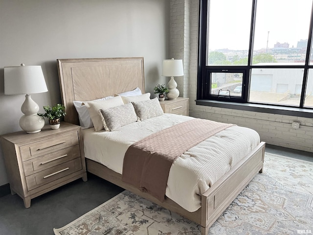 1001 SW Adams St Unit 101, Peoria, IL 61602 - bedroom featuring multiple windows and brick wall