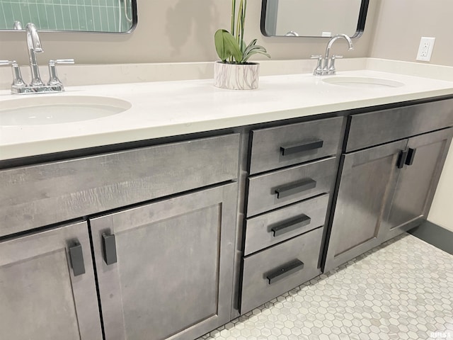 1001 SW Adams St Unit 101, Peoria, IL 61602 - bathroom with double vanity and tile patterned flooring