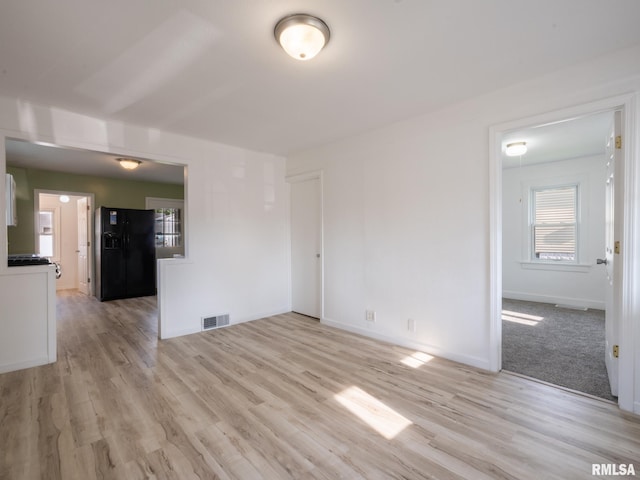 1108 Mechanic St, Pekin, IL 61554 - unfurnished living room with light wood-type flooring