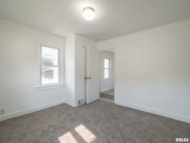 1108 Mechanic St, Pekin, IL 61554 - carpeted empty room with baseboards