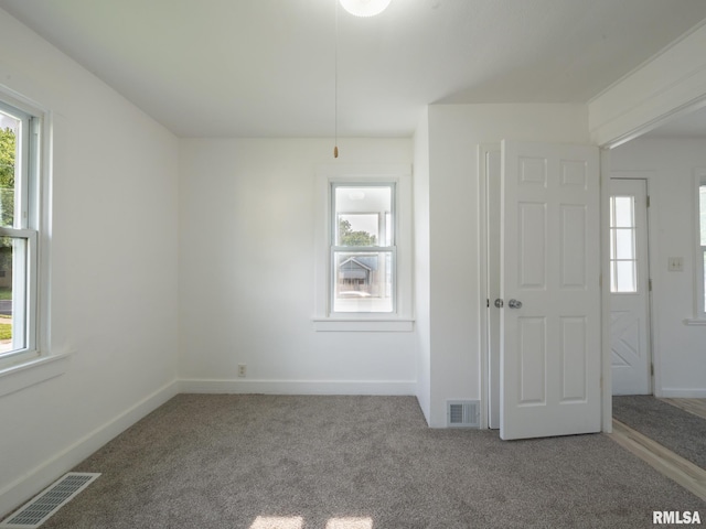 1108 Mechanic St, Pekin, IL 61554 - spare room featuring carpet flooring and healthy amount of natural light