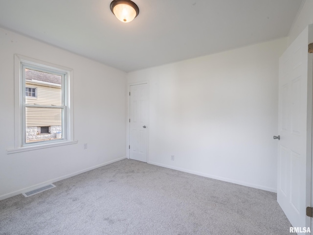 1108 Mechanic St, Pekin, IL 61554 - carpeted spare room with baseboards