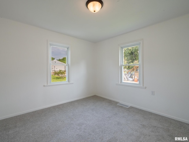 1108 Mechanic St, Pekin, IL 61554 - carpeted empty room with baseboards