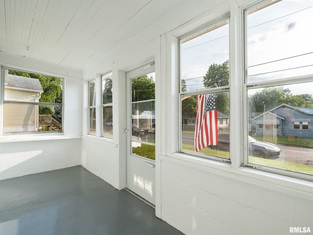 1108 Mechanic St, Pekin, IL 61554 - unfurnished sunroom with concrete floors and wooden ceiling