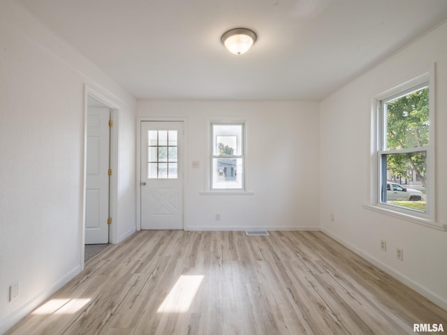 1108 Mechanic St, Pekin, IL 61554 - unfurnished room featuring healthy amount of natural light and light wood-type flooring