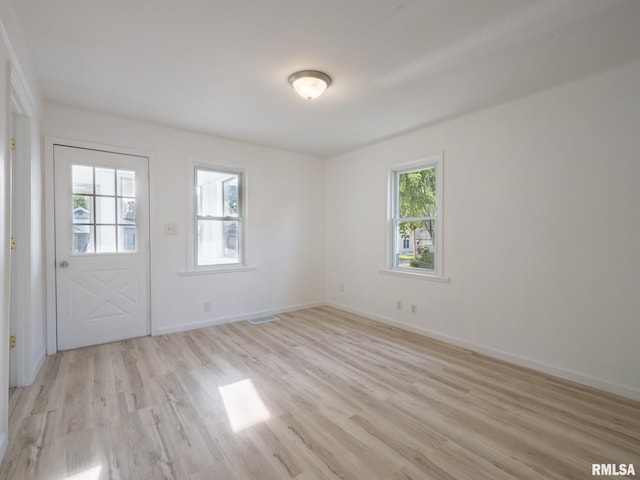 1108 Mechanic St, Pekin, IL 61554 - spare room with light wood-type flooring and baseboards