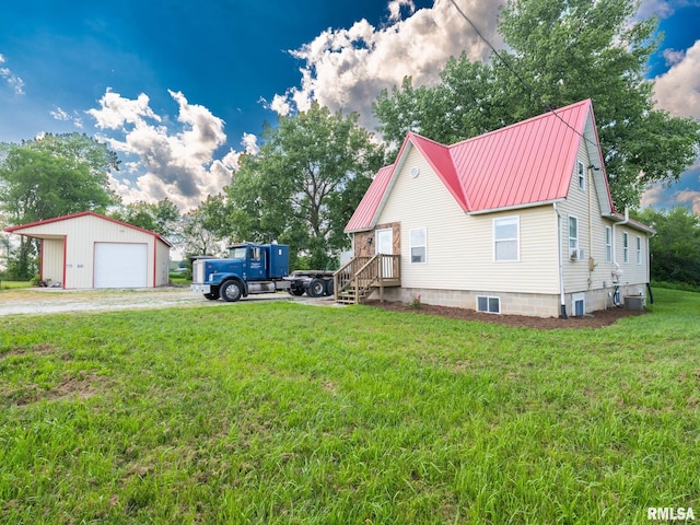 21218 E County Highway 17, Canton, IL 61520 - view of side of property with a detached garage, an outdoor structure, a yard, a metal roof, and dirt driveway