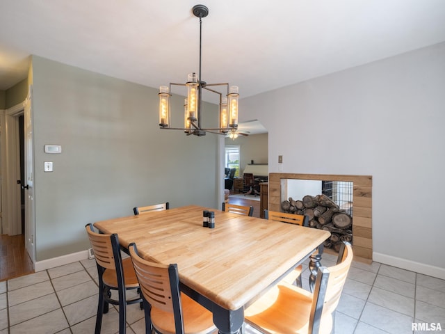 21218 E County Highway 17, Canton, IL 61520 - dining space with light tile patterned flooring, ceiling fan, and a chandelier