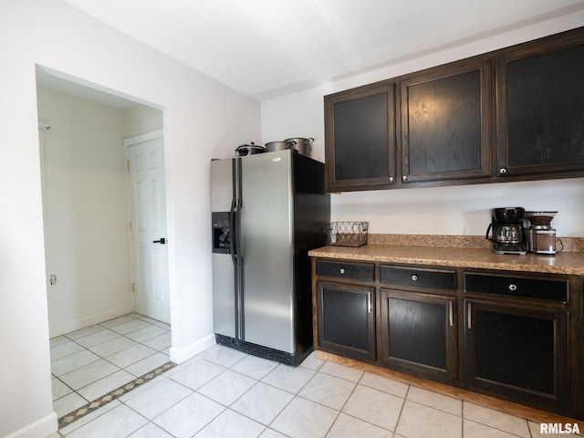 21218 E County Highway 17, Canton, IL 61520 - kitchen featuring stainless steel refrigerator with ice dispenser, dark brown cabinets, and light tile patterned flooring