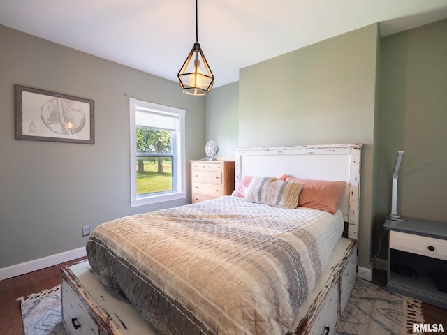 21218 E County Highway 17, Canton, IL 61520 - bedroom featuring baseboards and wood finished floors