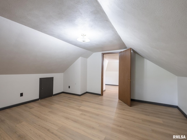 21218 E County Highway 17, Canton, IL 61520 - bonus room with a textured ceiling, light wood finished floors, and vaulted ceiling