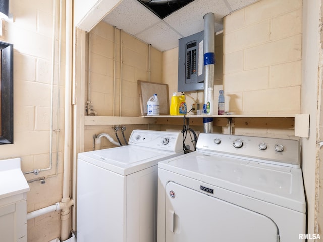 21218 E County Highway 17, Canton, IL 61520 - laundry room with separate washer and dryer, electric panel, and concrete block wall