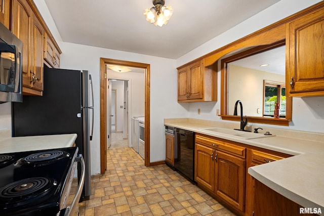 112 Iron Bark Ct, East Peoria, IL 61611 - kitchen with black dishwasher, stainless steel microwave, light countertops, and brown cabinets