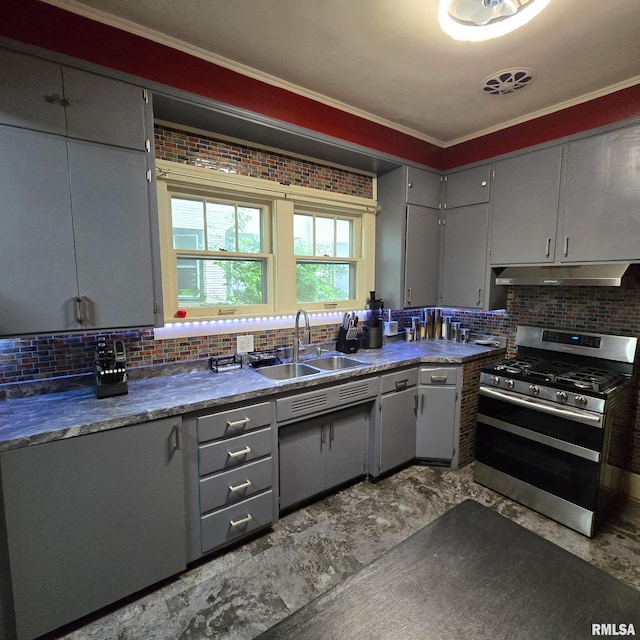 211 E Frye Ave, Peoria, IL 61603 - kitchen with gas range, under cabinet range hood, gray cabinetry, decorative backsplash, and crown molding