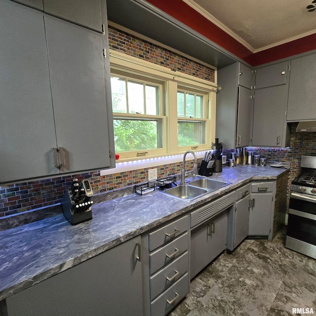 211 E Frye Ave, Peoria, IL 61603 - kitchen featuring gas range, backsplash, gray cabinetry, crown molding, and wall chimney exhaust hood