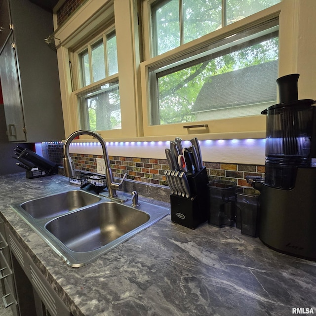 211 E Frye Ave, Peoria, IL 61603 - kitchen view of a sink and decorative backsplash