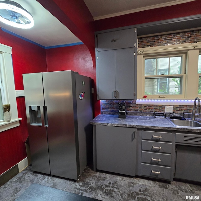 211 E Frye Ave, Peoria, IL 61603 - kitchen featuring stainless steel refrigerator with ice dispenser, gray cabinets, crown molding, dark countertops, and decorative backsplash