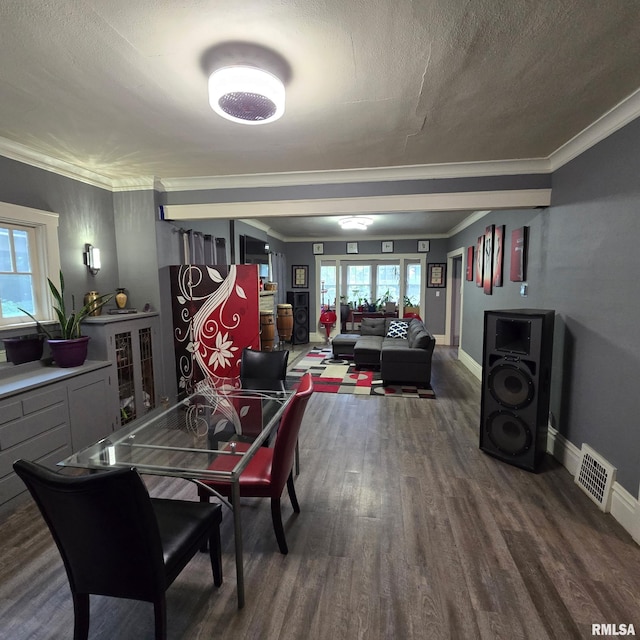211 E Frye Ave, Peoria, IL 61603 - dining room featuring wood finished floors, ornamental molding, and a textured ceiling