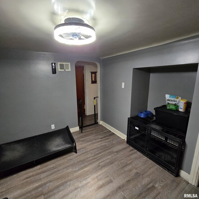 211 E Frye Ave, Peoria, IL 61603 - workout room featuring arched walkways and wood finished floors