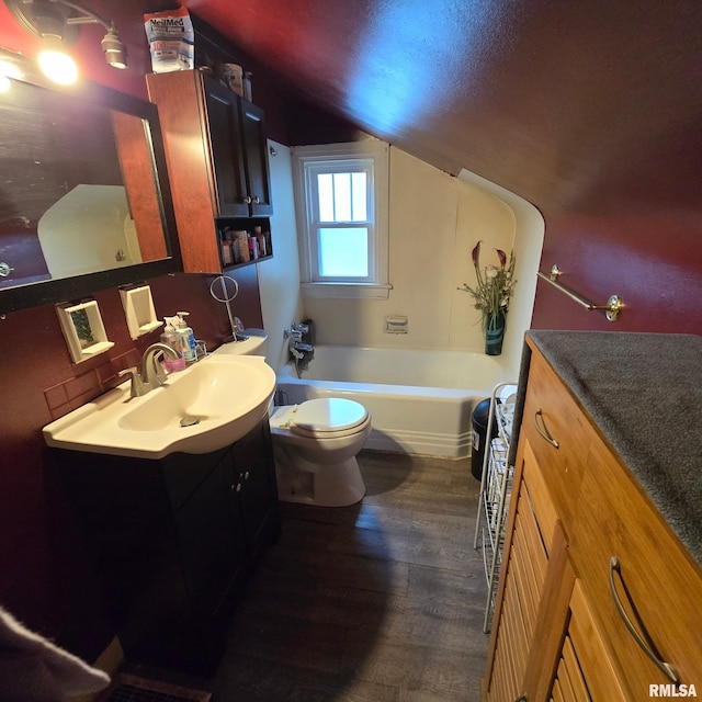 211 E Frye Ave, Peoria, IL 61603 - full bathroom featuring vanity, lofted ceiling, a tub, and wood finished floors
