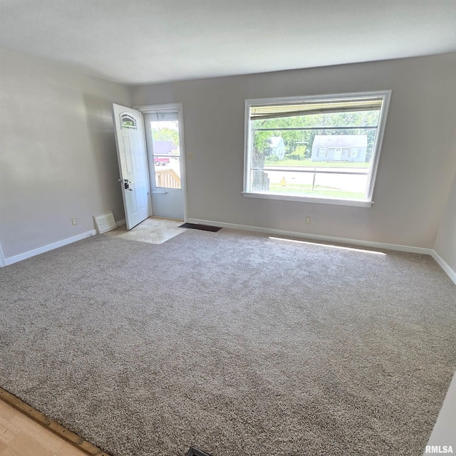 2029 W Forrest Hill Ave, Peoria, IL 61604 - carpeted empty room with baseboards