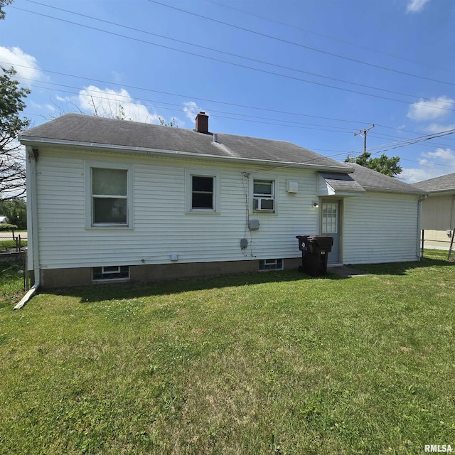 2029 W Forrest Hill Ave, Peoria, IL 61604 - back of property with a yard, a chimney, and a shingled roof