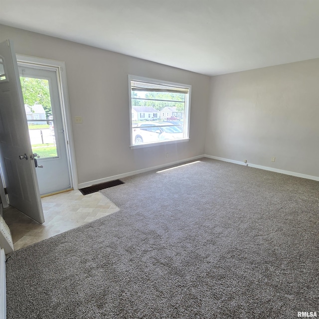 2029 W Forrest Hill Ave, Peoria, IL 61604 - unfurnished room featuring carpet and baseboards