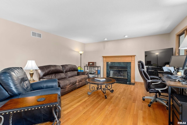 5408 N Rothmere Dr, Peoria, IL 61615 - living room featuring wood finished floors, an office area, a fireplace, and recessed lighting