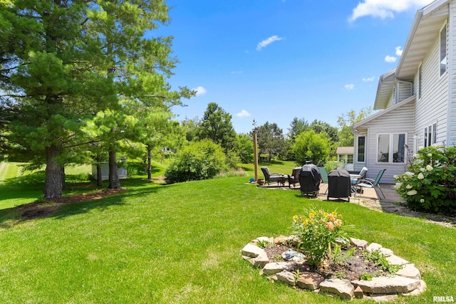 5408 N Rothmere Dr, Peoria, IL 61615 - view of grassy yard featuring a patio