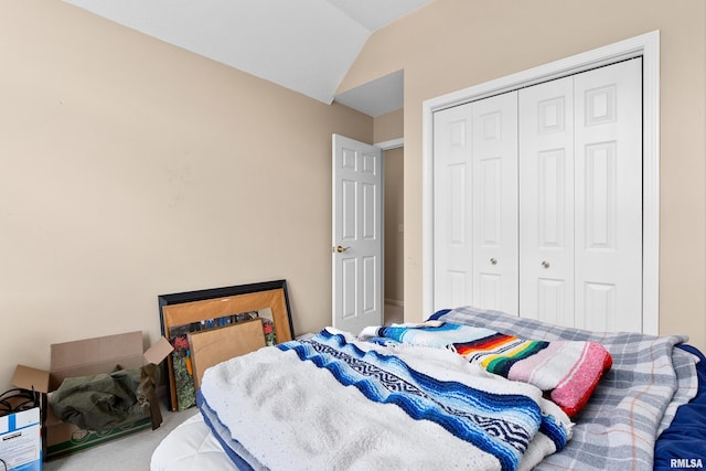 5408 N Rothmere Dr, Peoria, IL 61615 - bedroom with vaulted ceiling, a closet, and carpet flooring