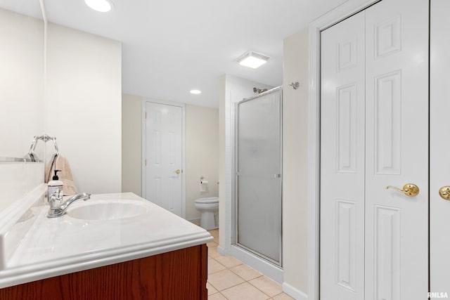 5408 N Rothmere Dr, Peoria, IL 61615 - bathroom with a closet, a shower stall, tile patterned flooring, vanity, and recessed lighting