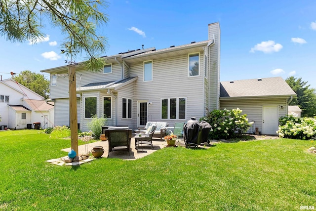 5408 N Rothmere Dr, Peoria, IL 61615 - rear view of house with a patio, a chimney, a yard, and an outdoor living space