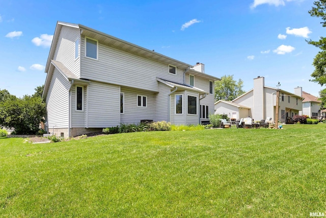 5408 N Rothmere Dr, Peoria, IL 61615 - back of property featuring a yard and a chimney