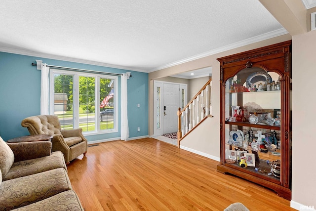 5408 N Rothmere Dr, Peoria, IL 61615 - living area featuring a chandelier, light wood-type flooring, and crown molding