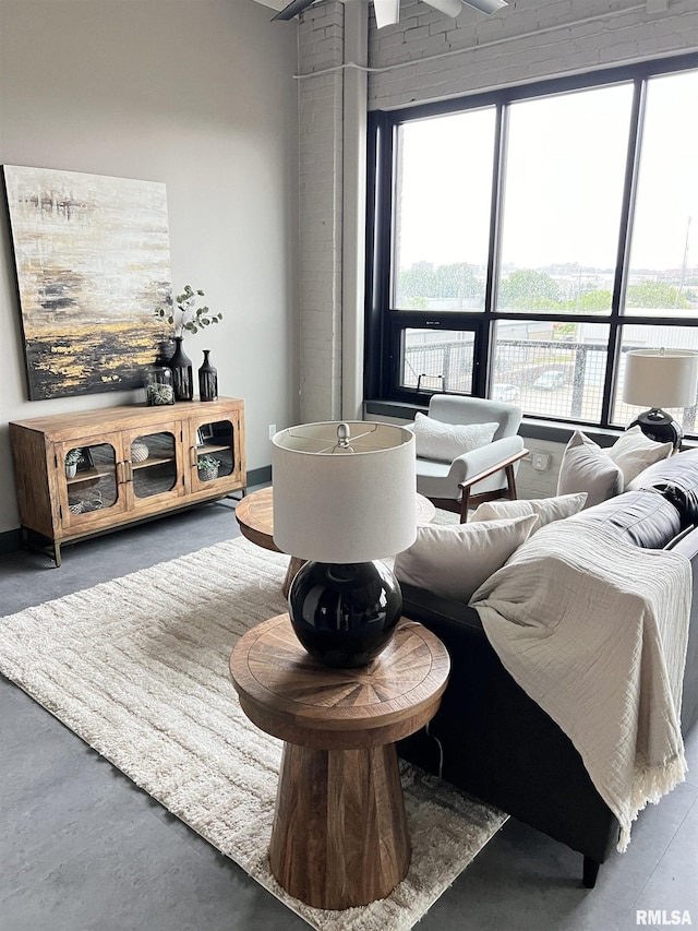 1001 SW Adams St Unit 102, Peoria, IL 61602 - living area featuring finished concrete flooring