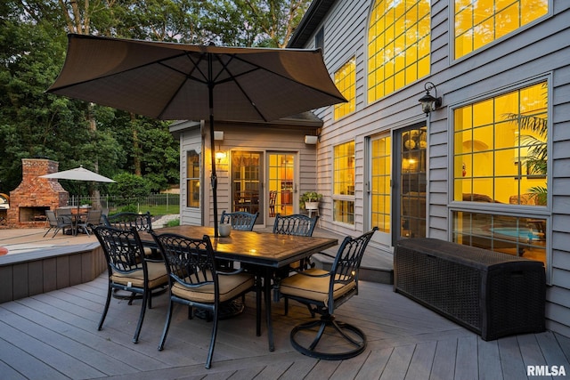 88 Waldheim Rd, Morton, IL 61550 - wooden terrace with outdoor dining area and an outdoor stone fireplace