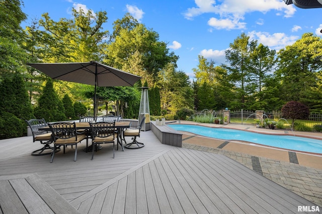 88 Waldheim Rd, Morton, IL 61550 - view of swimming pool featuring a wooden deck, outdoor dining area, and view of scattered trees