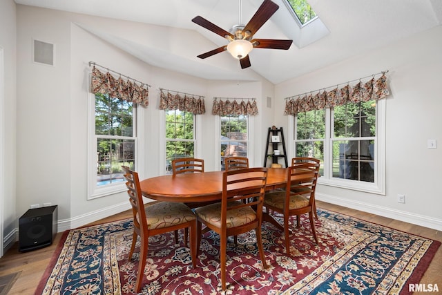 88 Waldheim Rd, Morton, IL 61550 - dining room with vaulted ceiling, ceiling fan, light wood-type flooring, and a skylight
