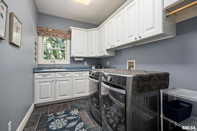 88 Waldheim Rd, Morton, IL 61550 - laundry room featuring cabinet space, washer and clothes dryer, stone tile flooring, and a textured ceiling