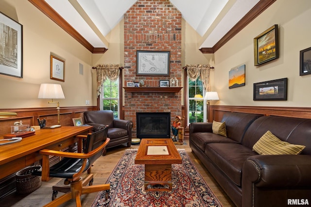 88 Waldheim Rd, Morton, IL 61550 - living room with wood finished floors, a wainscoted wall, lofted ceiling, a fireplace, and ornamental molding