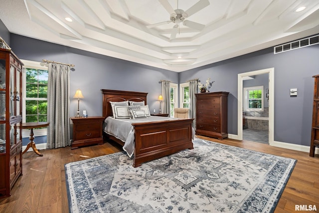 88 Waldheim Rd, Morton, IL 61550 - bedroom with multiple windows, a raised ceiling, wood finished floors, connected bathroom, and recessed lighting