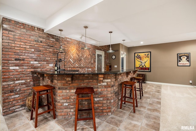 88 Waldheim Rd, Morton, IL 61550 - indoor wet bar featuring brick wall, pendant lighting, light carpet, and recessed lighting