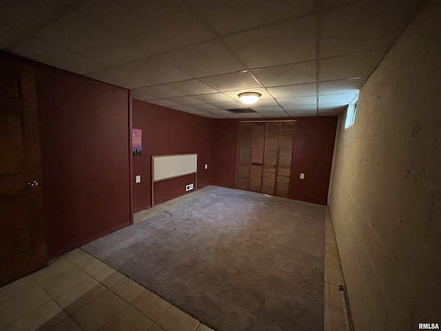 1208 S 13th St, Pekin, IL 61554 - finished basement featuring a paneled ceiling, concrete block wall, and carpet floors