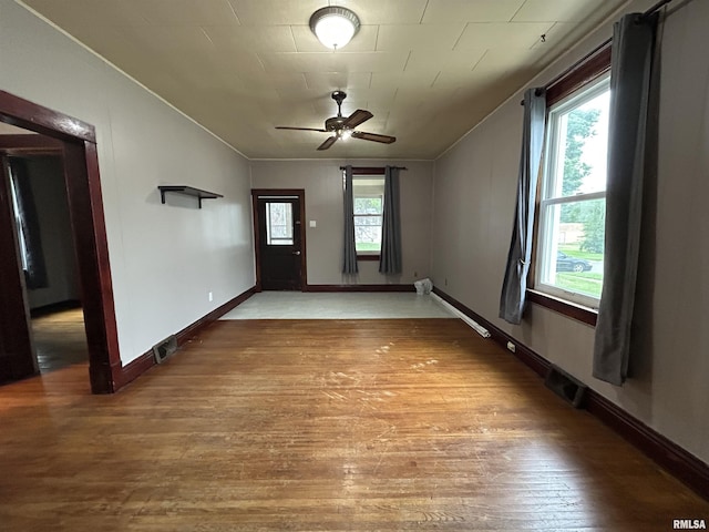 1208 S 13th St, Pekin, IL 61554 - empty room with wood finished floors and a ceiling fan