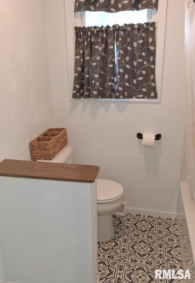 751 N 3rd St, Cuba, IL 61427 - bathroom with toilet and tile patterned flooring