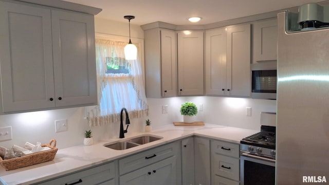 751 N 3rd St, Cuba, IL 61427 - kitchen with appliances with stainless steel finishes, pendant lighting, and light stone counters