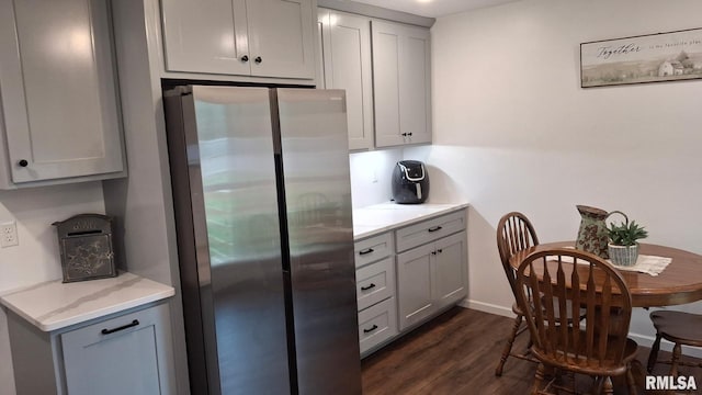 751 N 3rd St, Cuba, IL 61427 - kitchen with freestanding refrigerator, gray cabinetry, dark wood finished floors, and light stone countertops