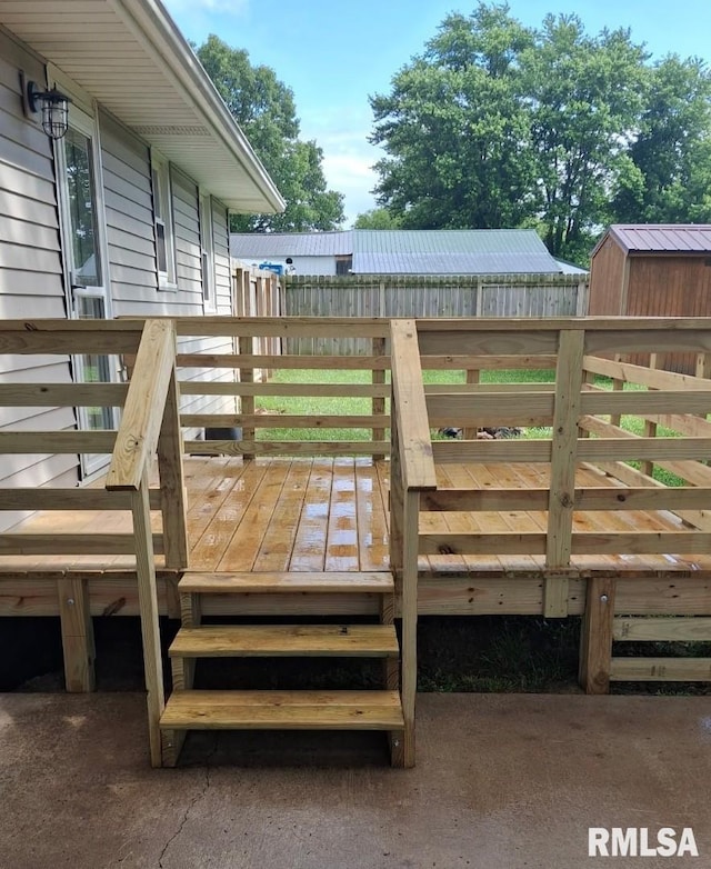 751 N 3rd St, Cuba, IL 61427 - wooden deck with a storage shed