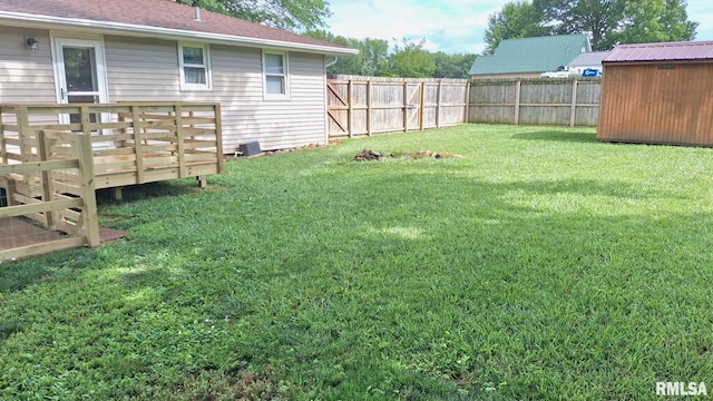 751 N 3rd St, Cuba, IL 61427 - fenced backyard with a deck and a shed