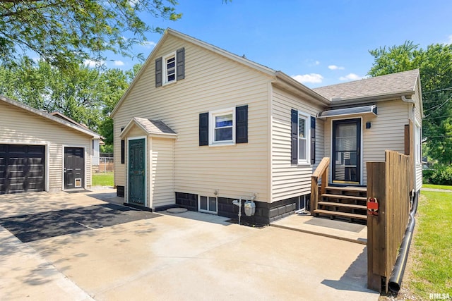 1603 Willow St, Pekin, IL 61554 - view of side of property with roof with shingles, driveway, and an outdoor structure